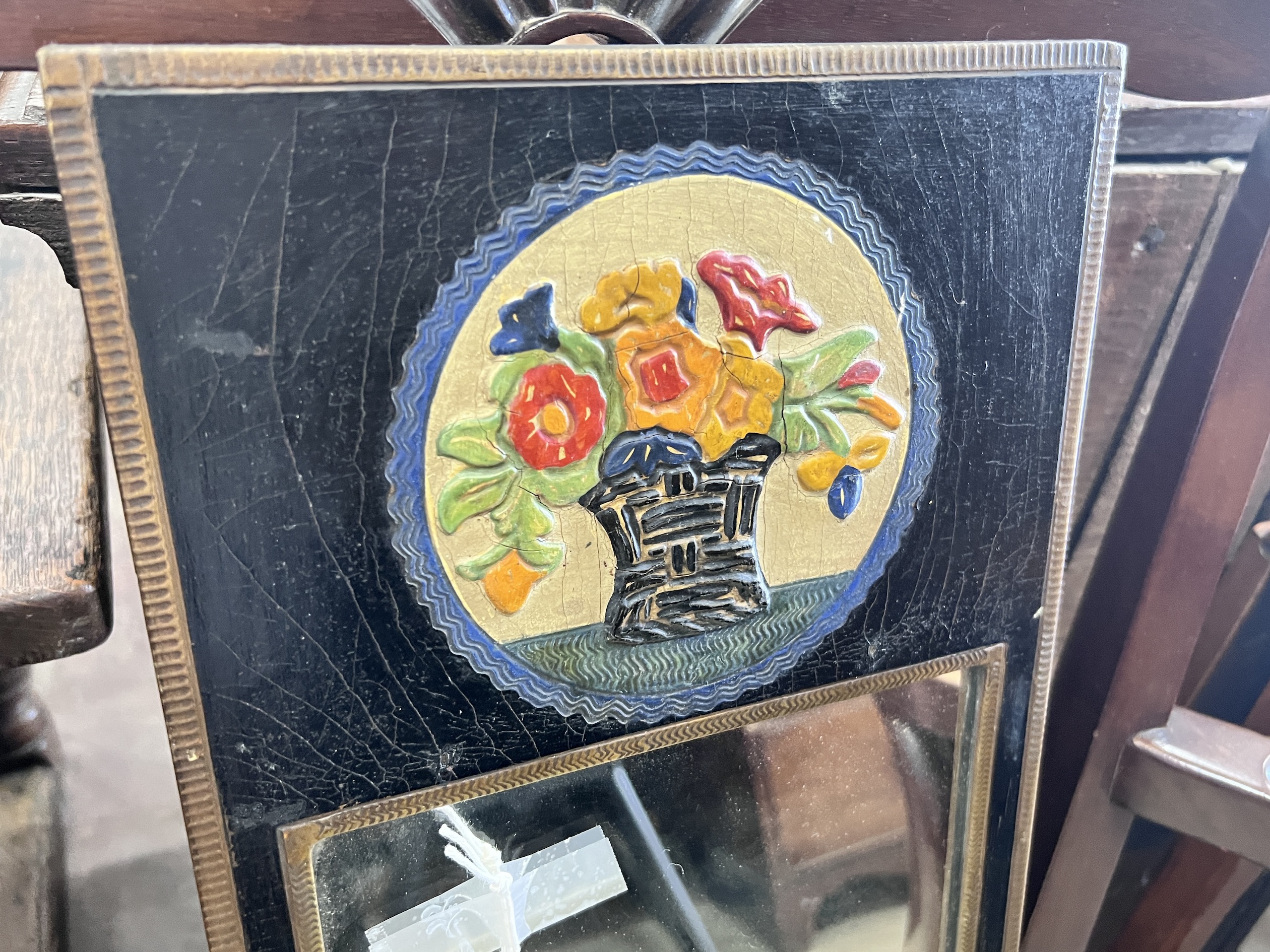 A small mid century rectangular painted and embossed wall mirror, width 124cm, height 50cm